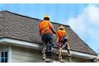 Re-roofing crew safely removing older roof from residential property